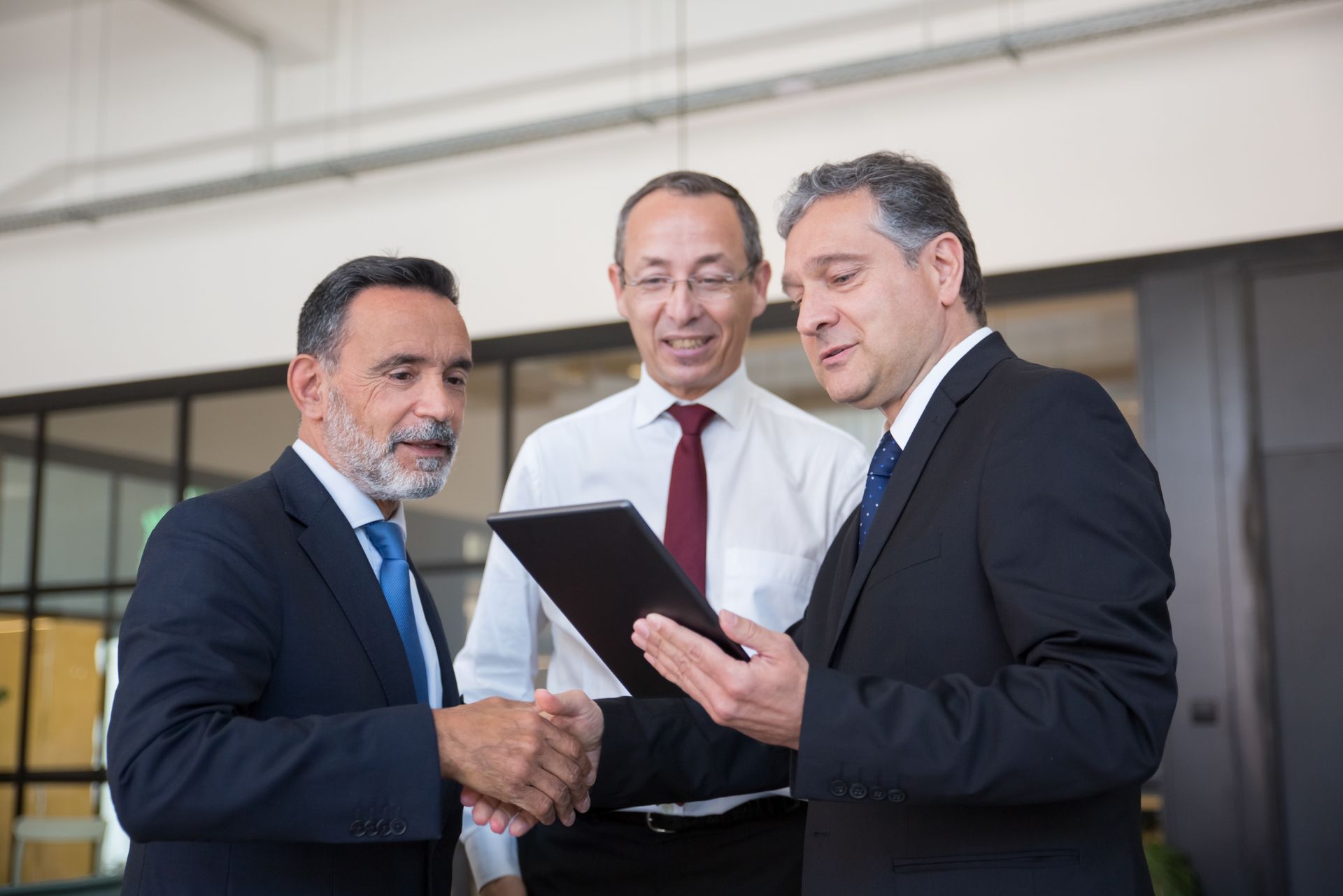 Executives reviewing an IT plan on a tablet
