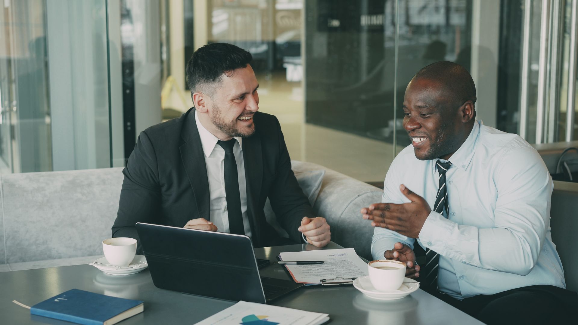 Bellevue IT support consultant and client reviewing a laptop together